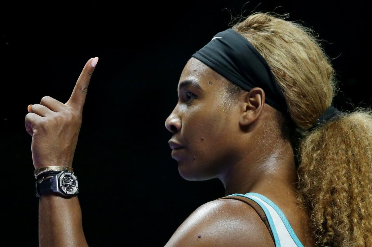 Serena Williams gestures to the chair umpire during her match against Eugenie Bouchard at the WTA Finals in Singapore. Williams defeated Bouchard, 6-1, 6-1.