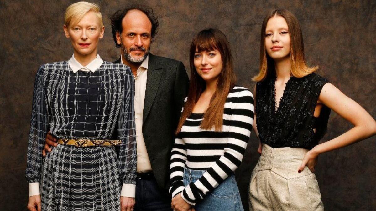 Actress Tilda Swinton, left, director Luca Guadagnino and actresses Dakota Johnson and Mia Goth, collaborators on the stylish horror remake of "Suspiria."