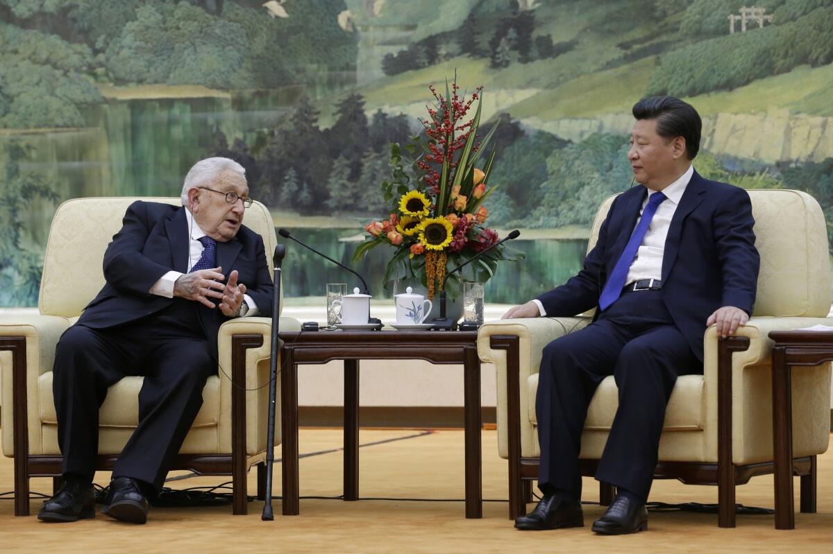 Henry Kissinger speaking to Chinese President Xi Jinping