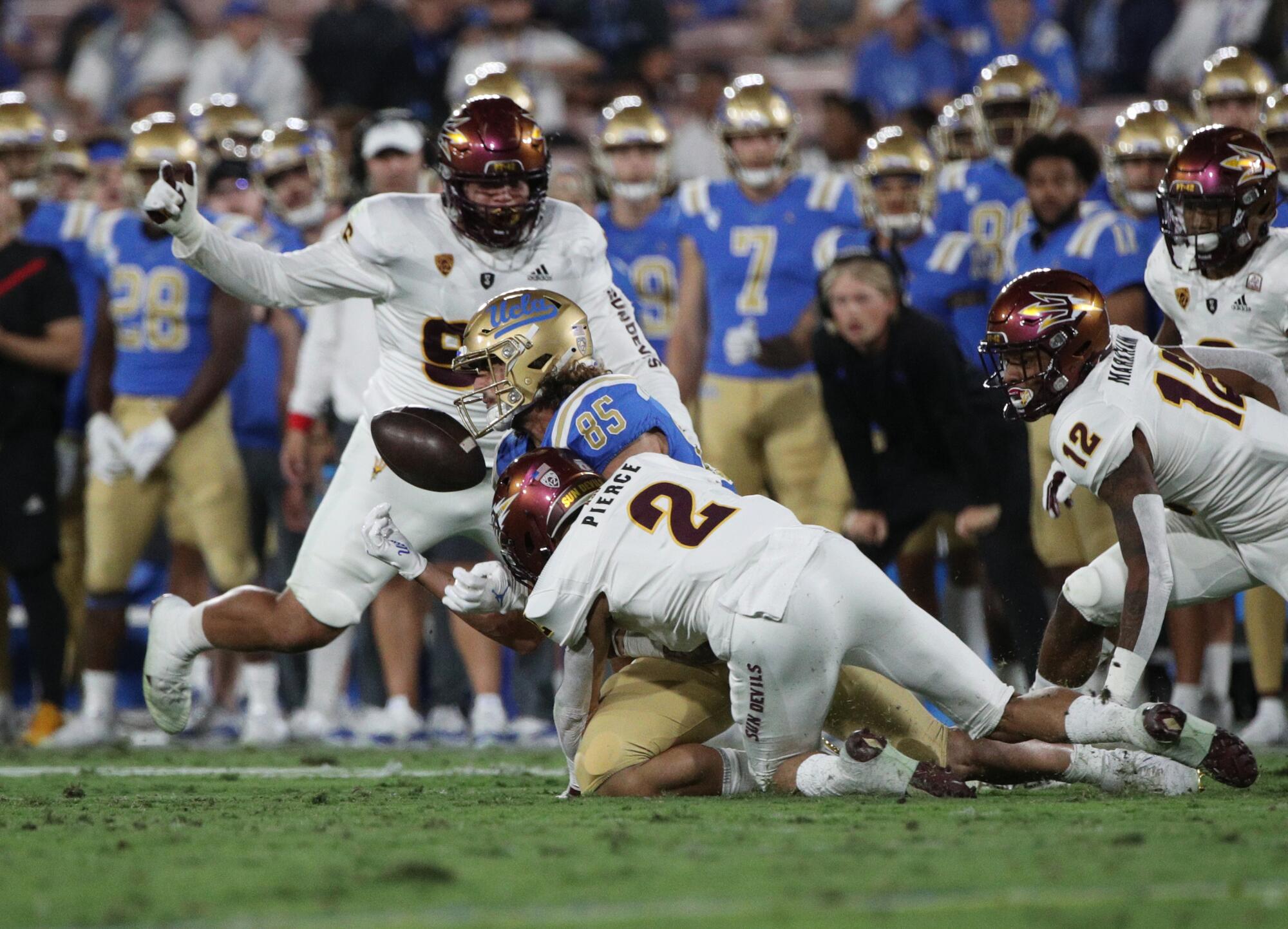 UCLA tight end Greg Dulcich can't make a catch as he's hit by Arizona State defensive back DeAndre Pierce.