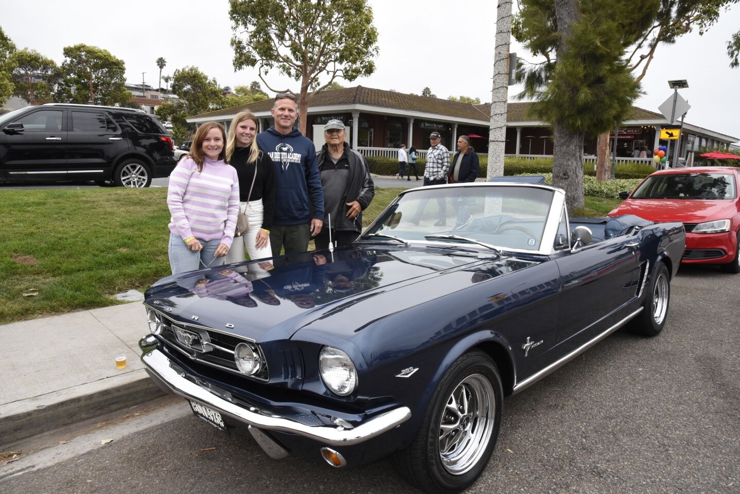 Jenny Whibbs, Maggie Whibbs, Vinnie Whibbs, David Babcock, with their classic Mustang