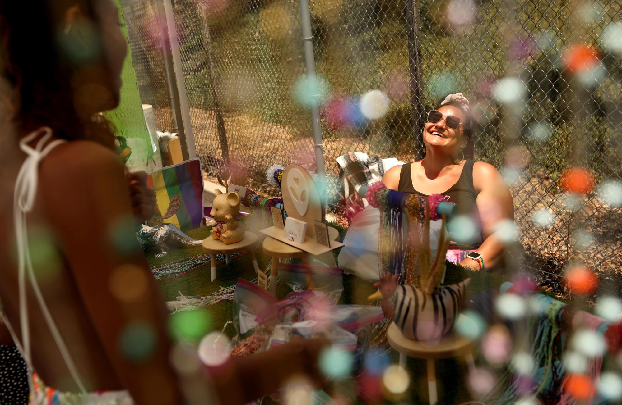 Estrella Esquivel, right, owner of the Prickly Pear Affair, enjoys a light moment