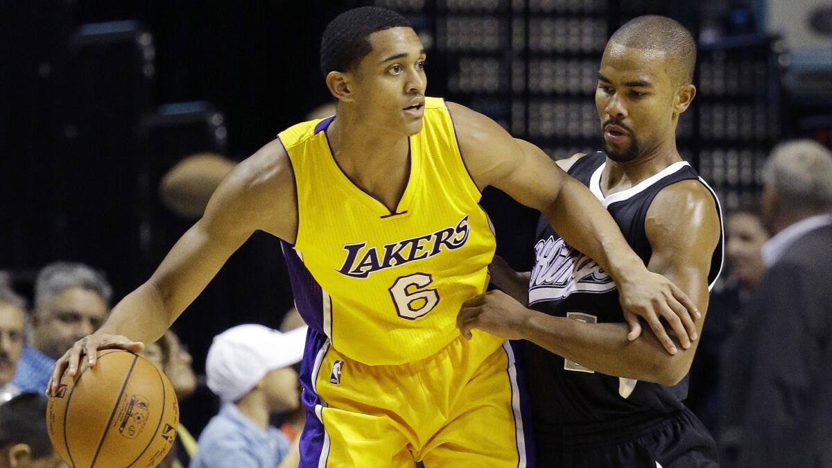 Lakers guard Jordan Clarkson, left, tries to drive around Sacramento Kings guard Ramon Sessions during an exhibition game on Friday.