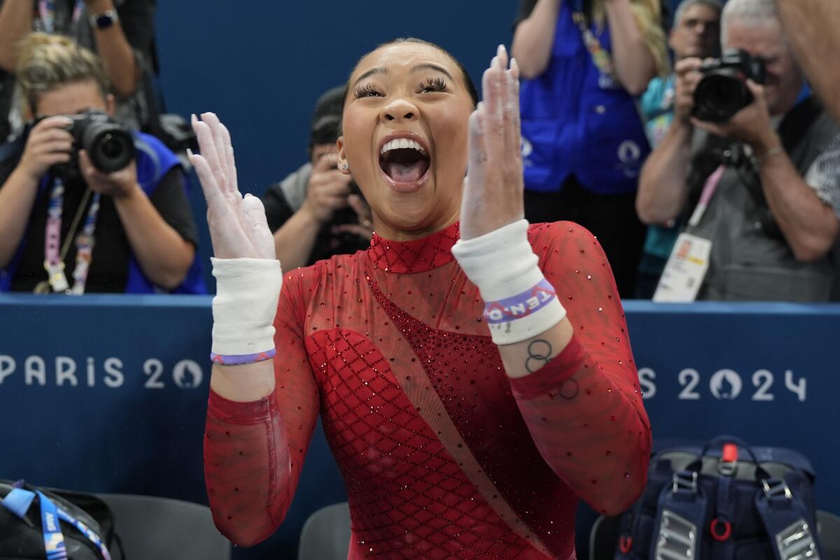 U.S. gymnast Suni Lee celebrates after winning the bronze medal on the uneven bars at the Paris Olympic Games on Sunday.