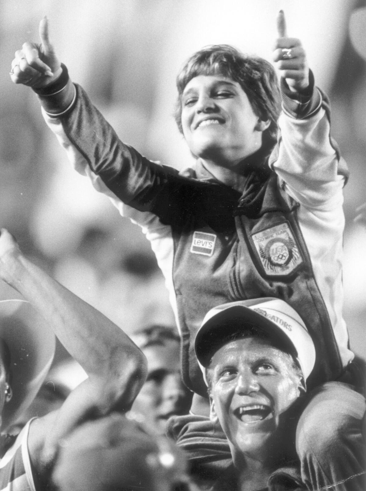 Gymnastics gold medal winner Mary Lou Retton participates in closing ceremonies of the 1984 Olympic Games.