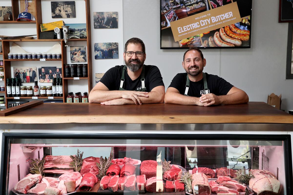 Chef Michael Puglisi, right, and CEO Steve Sabicer at Electric City Butcher in Santa Ana.