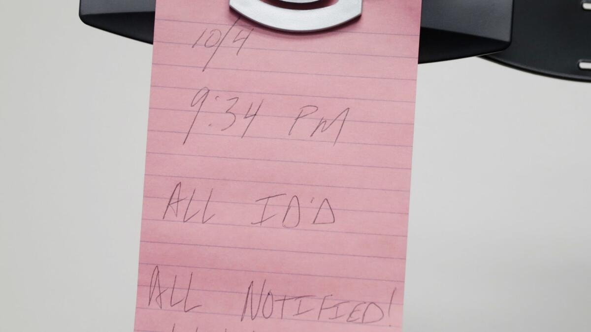A note hanging from Clark County Coroner John Fudenberg's computer.