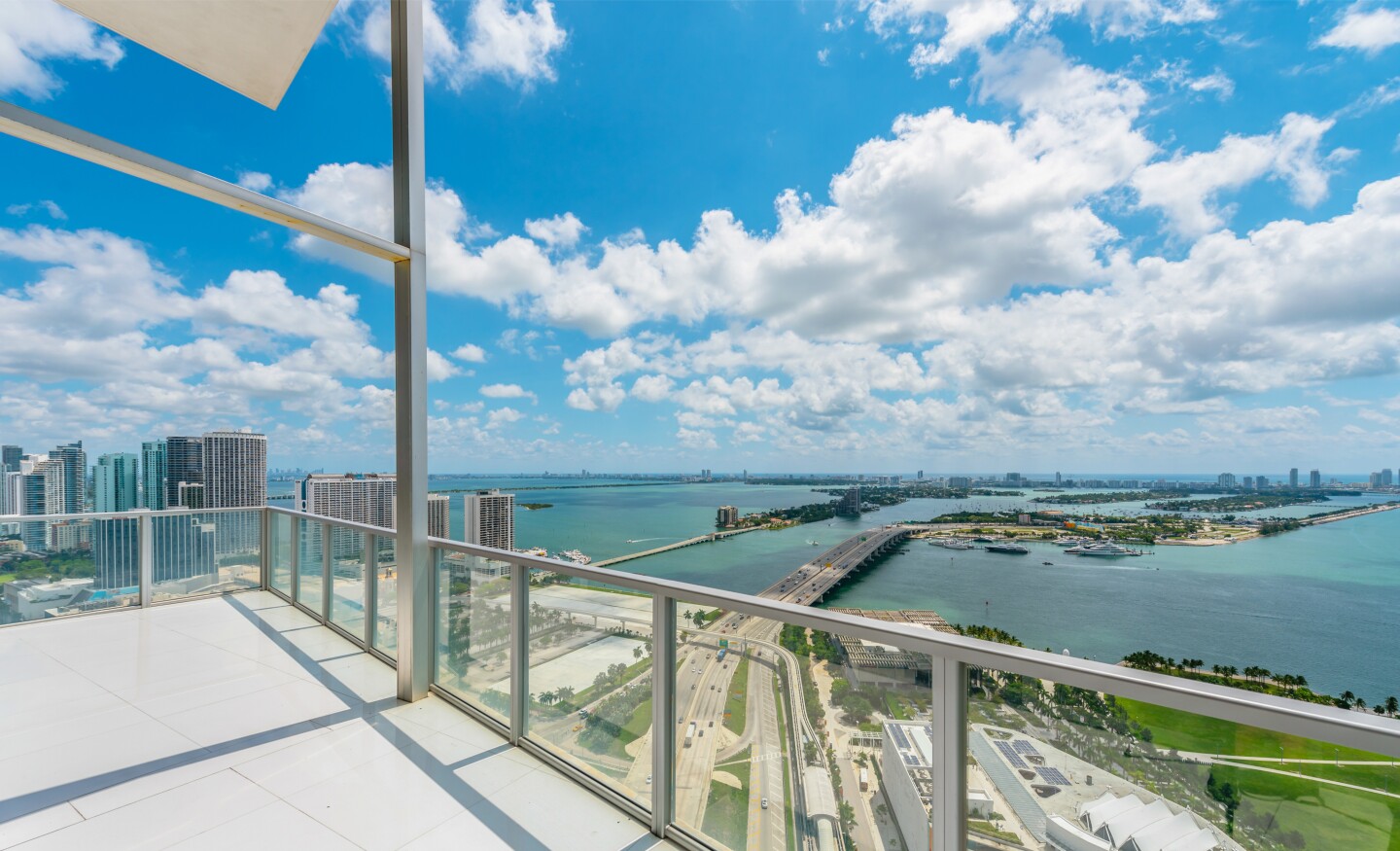 The corner-unit condo takes in sweeping city and ocean views across 3,850 square feet of sleek living spaces.