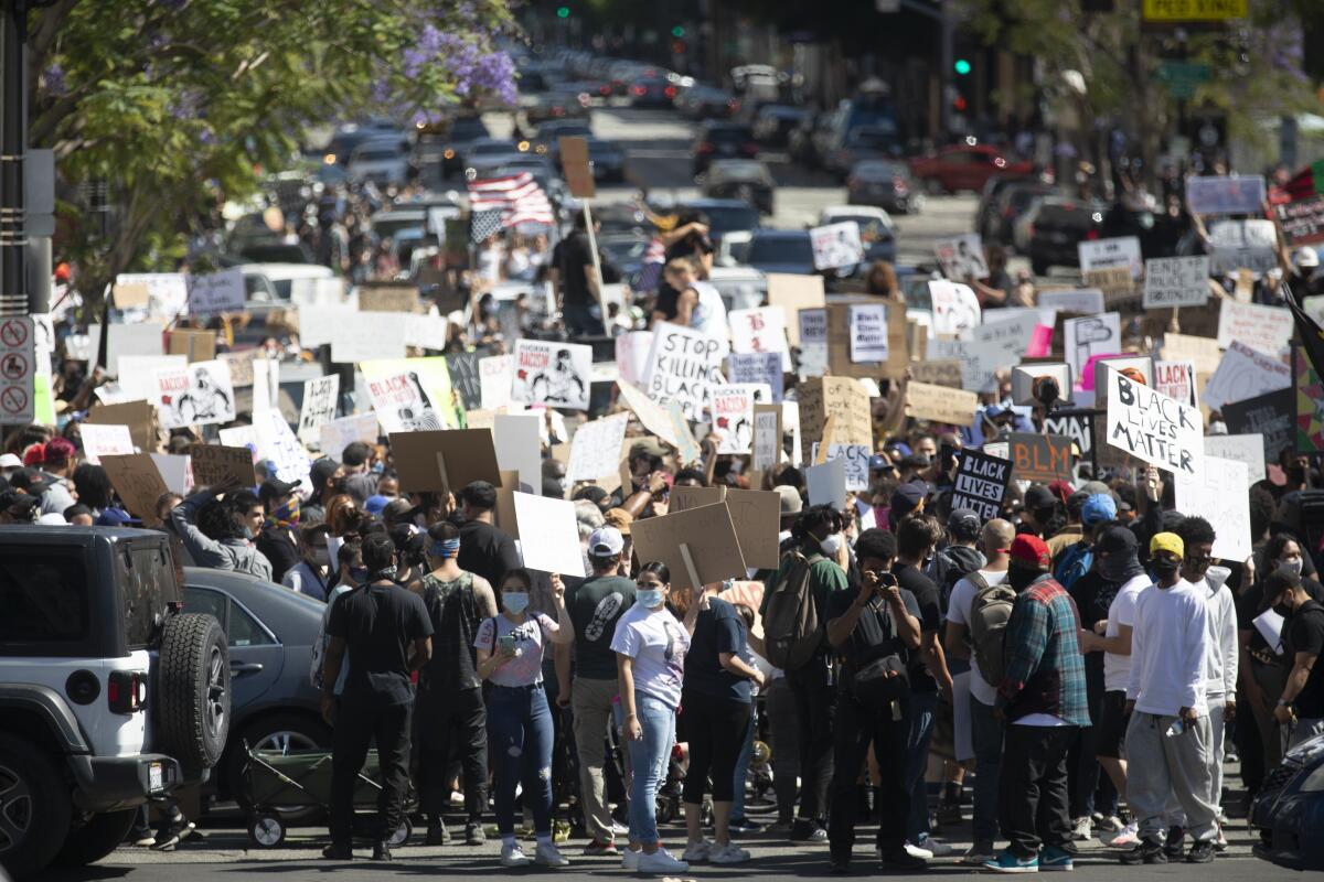 Thousands participate in a peaceful march through Hollywood on Sunday.