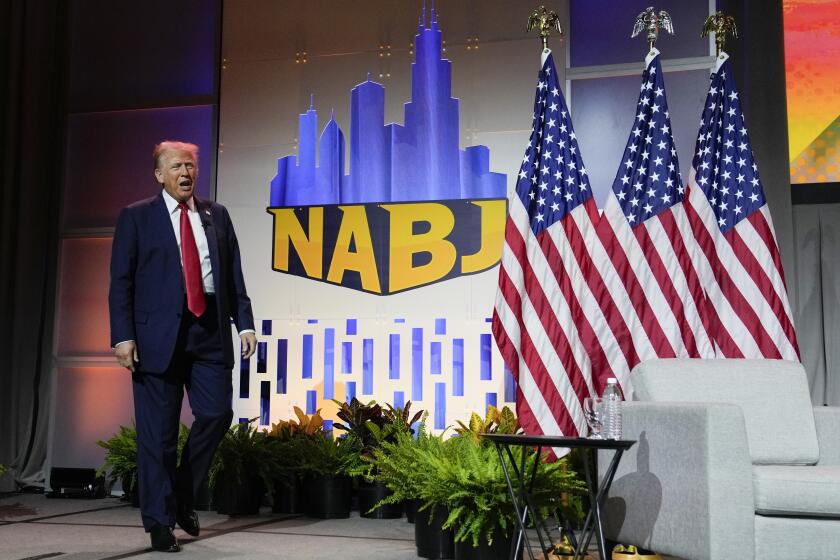 Republican presidential candidate former President Donald Trump walks on stage at the National Association of Black Journalists, NABJ, convention, Wednesday, July 31, 2024, in Chicago. (AP Photo/Charles Rex Arbogast)
