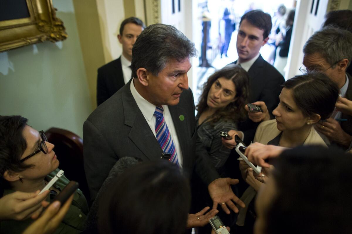 Sen. Joe Manchin (D-W.V.) speaks to the media about the background check bill at the Capitol in Washington.