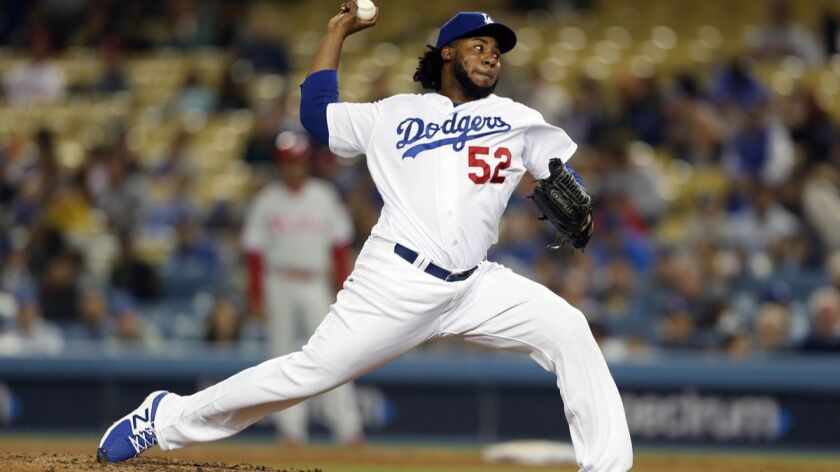 Dodgers reliever Pedro Baez, above, was optioned to triple-A Oklahoma City to make room on the active roster for starting pitcher Caleb Ferguson.