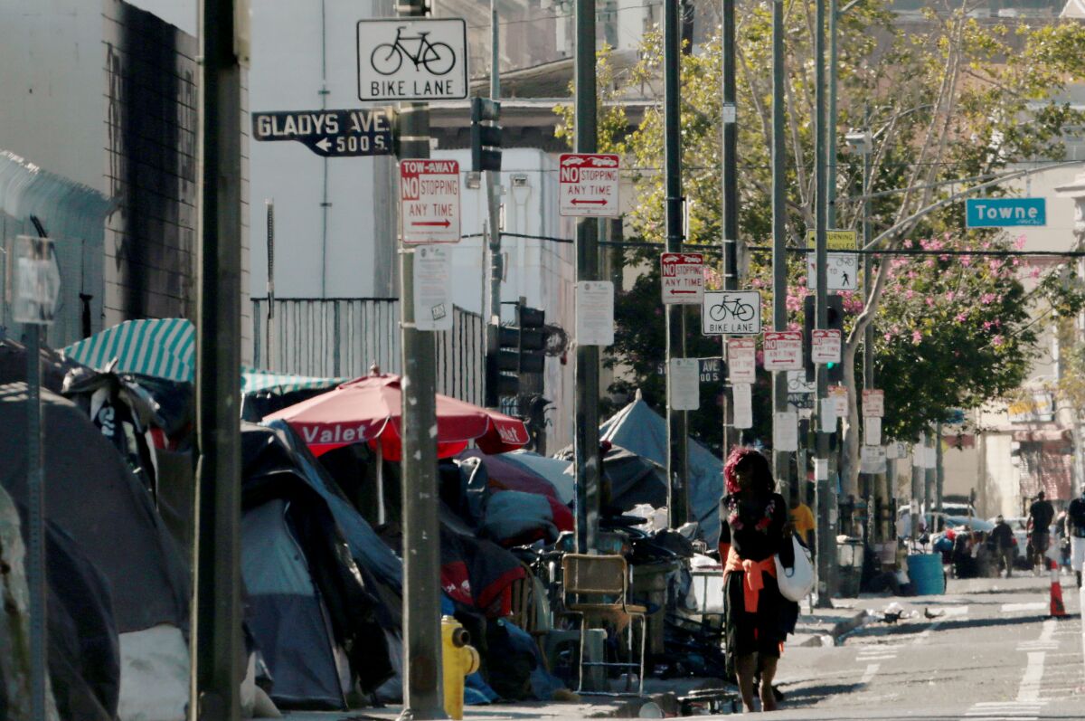 Homeless encampments line the sidewalk along 5th Street in downtown Los Angeles