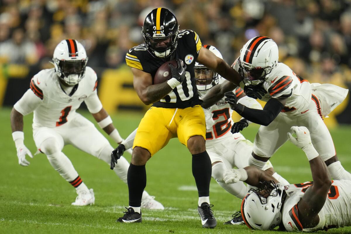Pittsburgh Steelers running back Jaylen Warren carries the ball against the Cleveland Browns.