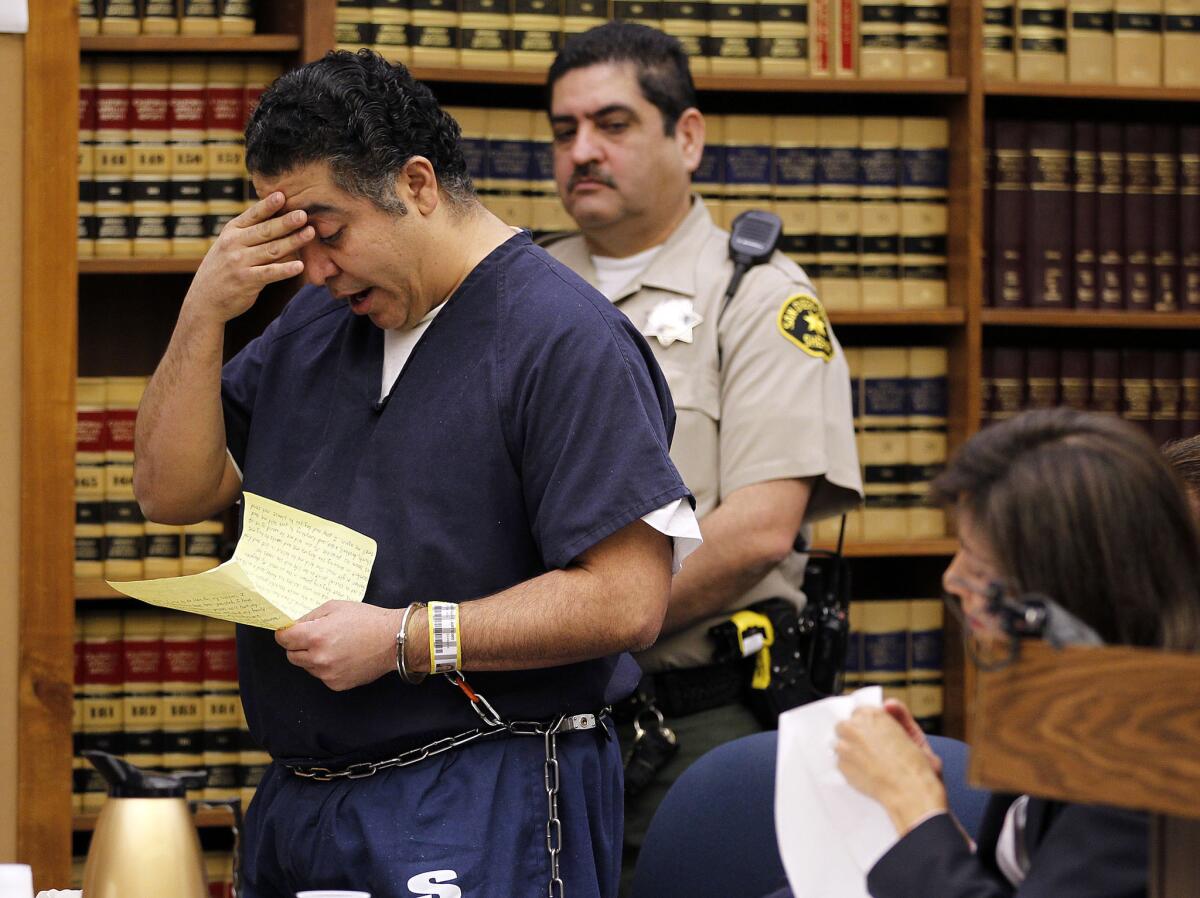 Former San Diego Police Officer Anthony Arevalos cries as he reads a statement in court in San Diego in 2012. The city settled Thursday with one of his victims for $5.9 million.