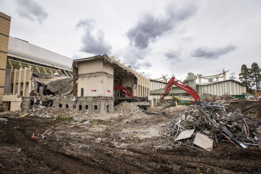 LOS ANGELES, CA -- TUESDAY, APRIL 7, 2020: A construction crew begins demolition at LACMA, a huge symbolic move in the building of its new campus in Los Angeles, CA, on April 7, 2020. (Allen J. Schaben / Los Angeles Times)