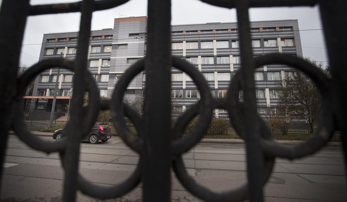Three international track federation officials were suspended Friday for allegedly receiving cash to conceal positive tests by Russian athletes. Above, Russia's national drug-testing laboratory in Moscow.
