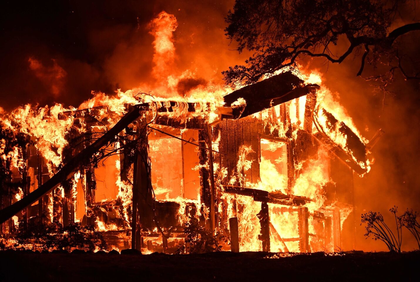 Flames ravage a home in the Napa wine region in California.
