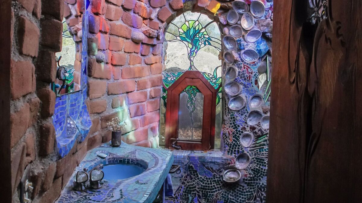 Mosaics, shells and stained glass decorate a bathroom in the Santa Ysabel home of iconic local artist James Hubbell.