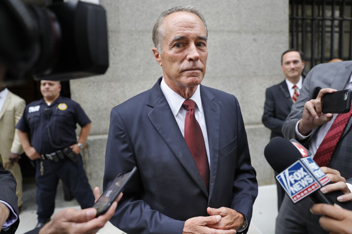Rep. Chris Collins (R-N.Y.) speaks to reporters as he leaves the courthouse after a pretrial hearing in his insider trading case on Sept. 12 in New York. 