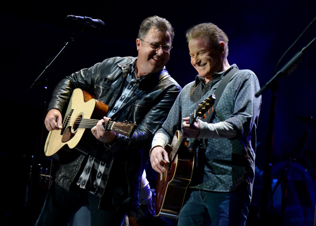 Vince Gill, left, and Don Henley perform with the Eagles during the Classic West concert at Dodger Stadium in July.