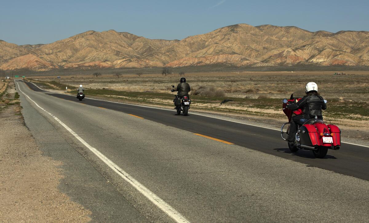 Motorcyclists travel along Route 33 in Ventucopa, Calif.