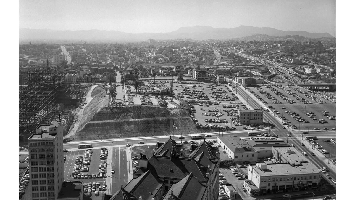June 6, 1956: West. That's the way you were looking in the photo from the City Hall tower. That's the roof of the Hall of Records in the foreground. Over at the left is the Law Building and steel structure for the new County Courthouse. Beyond Temple St. at the right it the four-level interchange of the freeways and, way at the left, Beverly Blvd. goes over Belmont Hill. Hollywood and the Hollywood Hills are out there in the haze somewhere.