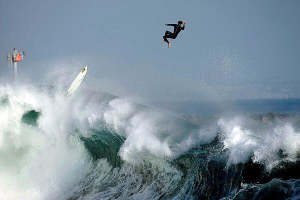 Bobby Okvist, 18, of Newport Beach bails off his board after riding a large wave at the Wedge in Newport Beach. Some waves, from a south swell originating in the Pitcairn Island area of the South Pacific, were reaching 20 feet on the face. See full story.