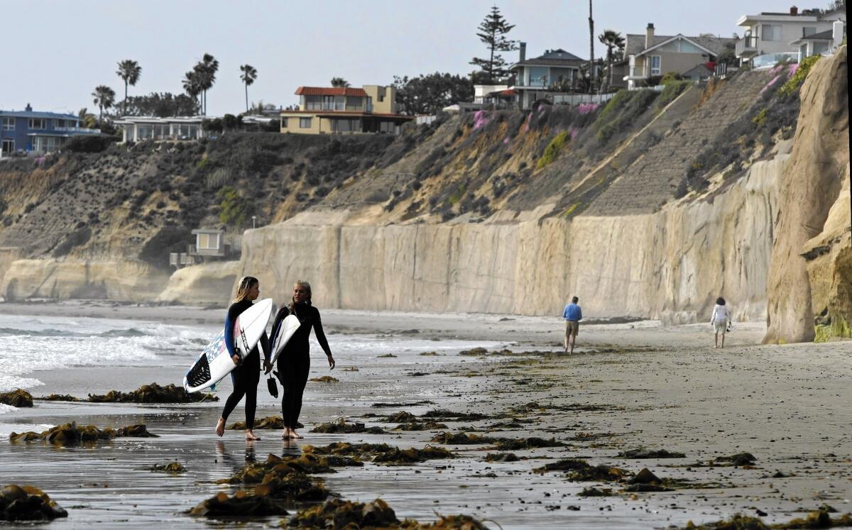 Sea walls line the bluffs in Solana Beach. Permit applicants already pay a sand replacement fee.