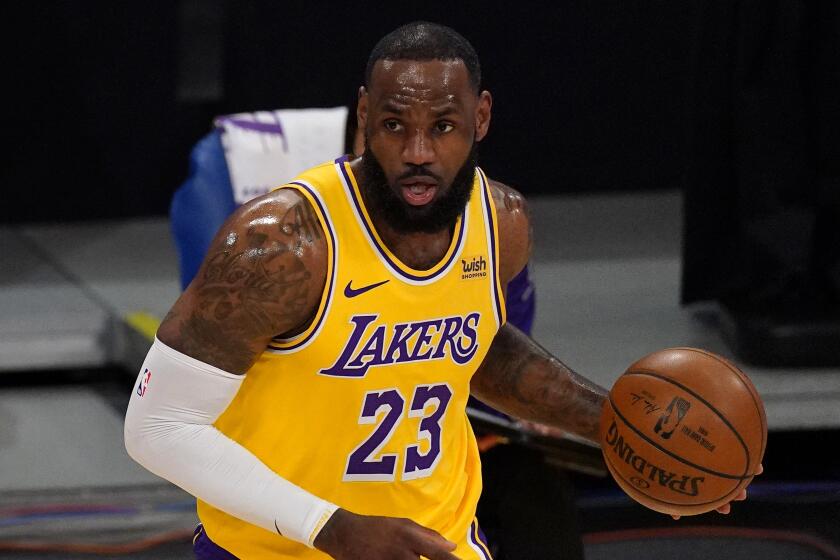 Los Angeles Lakers forward LeBron James dribbles.