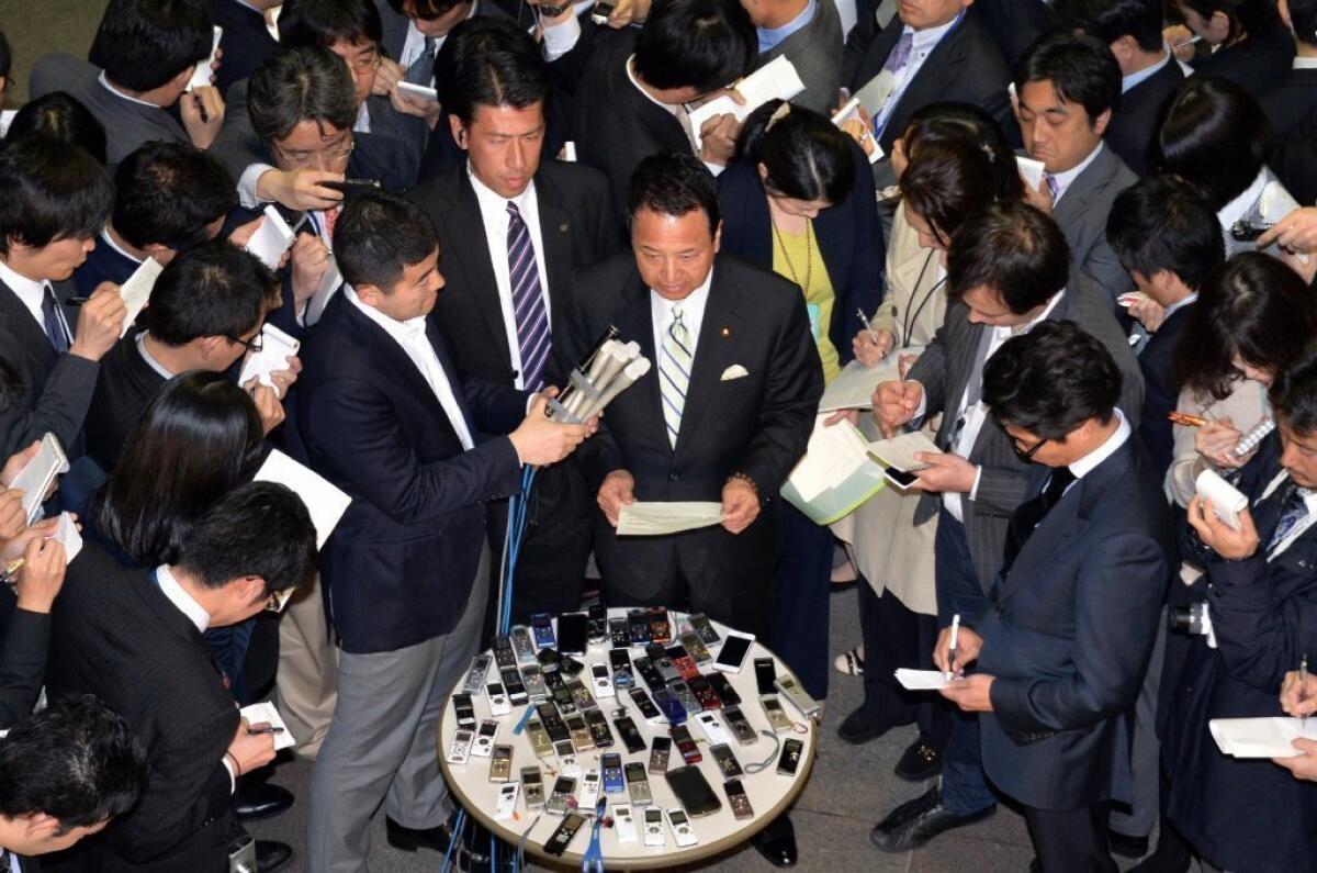Japan's economic minister, Akira Amari, tells reporters in Tokyo that the U.S. and Japan failed to reach an accord on a free-trade deal.