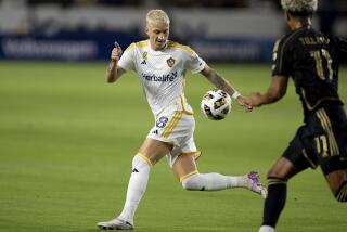 Galaxy forward Marco Reus, left, controls the ball in front of LAFC midfielder Timothy Tillman.