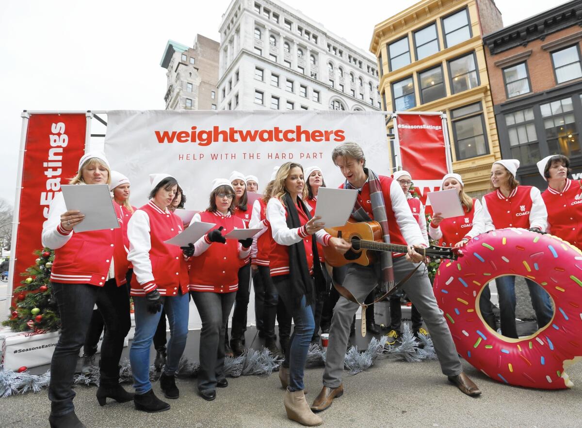 Viral video stars Kim and Penn Holderness help launch Weight Watchers Personal Coaching and 24/7 Expert Chat in New York in December 2014.
