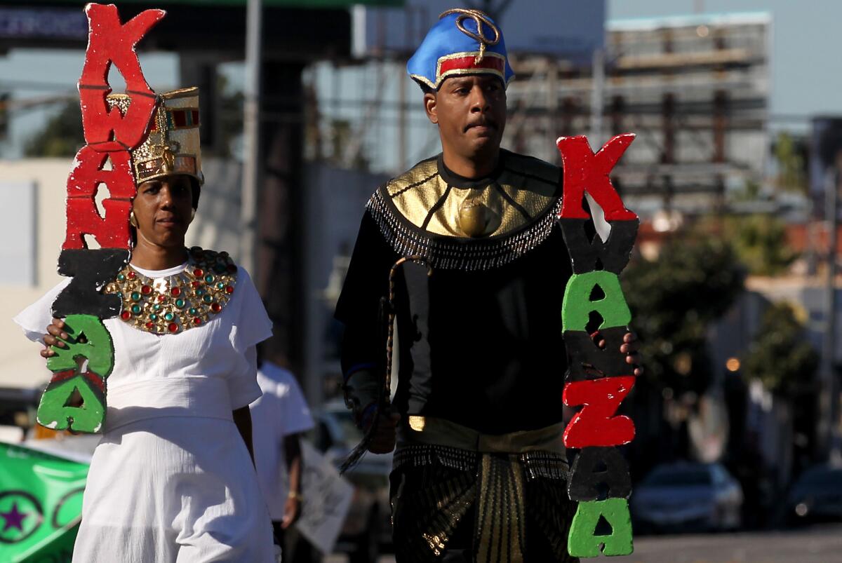 Participants march in a Kwanzaa parade in Los Angeles in 2014.