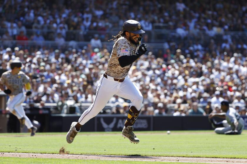 San Diego, CA - May 26: San Diego Padres' Fernando Tatis Jr. runs to first base on a RBI single scoring Ha-Seong Kim in the sixth inning against the New York Yankees at Petco Park on Wednesday, May 26, 2024. (K.C. Alfred / The San Diego Union-Tribune)