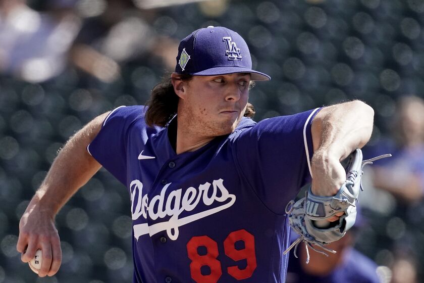 Los Angeles Dodgers starting pitcher Ryan Pepiot throws during the first inning of a spring training baseball game against the Texas Rangers Thursday, March 31, 2022, in Surprise, Ariz. (AP Photo/Charlie Riedel)