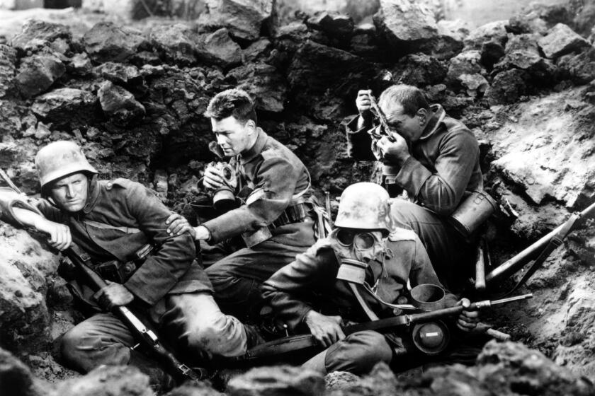 CA.All Quiet.0518.––A young German (Lew Ayres, second from left) is transformed from an enthusiastic supporter to a war–weary soldier, in the world premiere of the newly restored version of "All Quiet on the Western Front (1930.)"Photo/Art by:Photofest