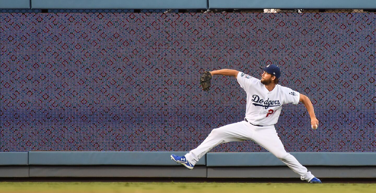 Dodgers starting pitcher Clayton Kershaw warms up before Game 2.