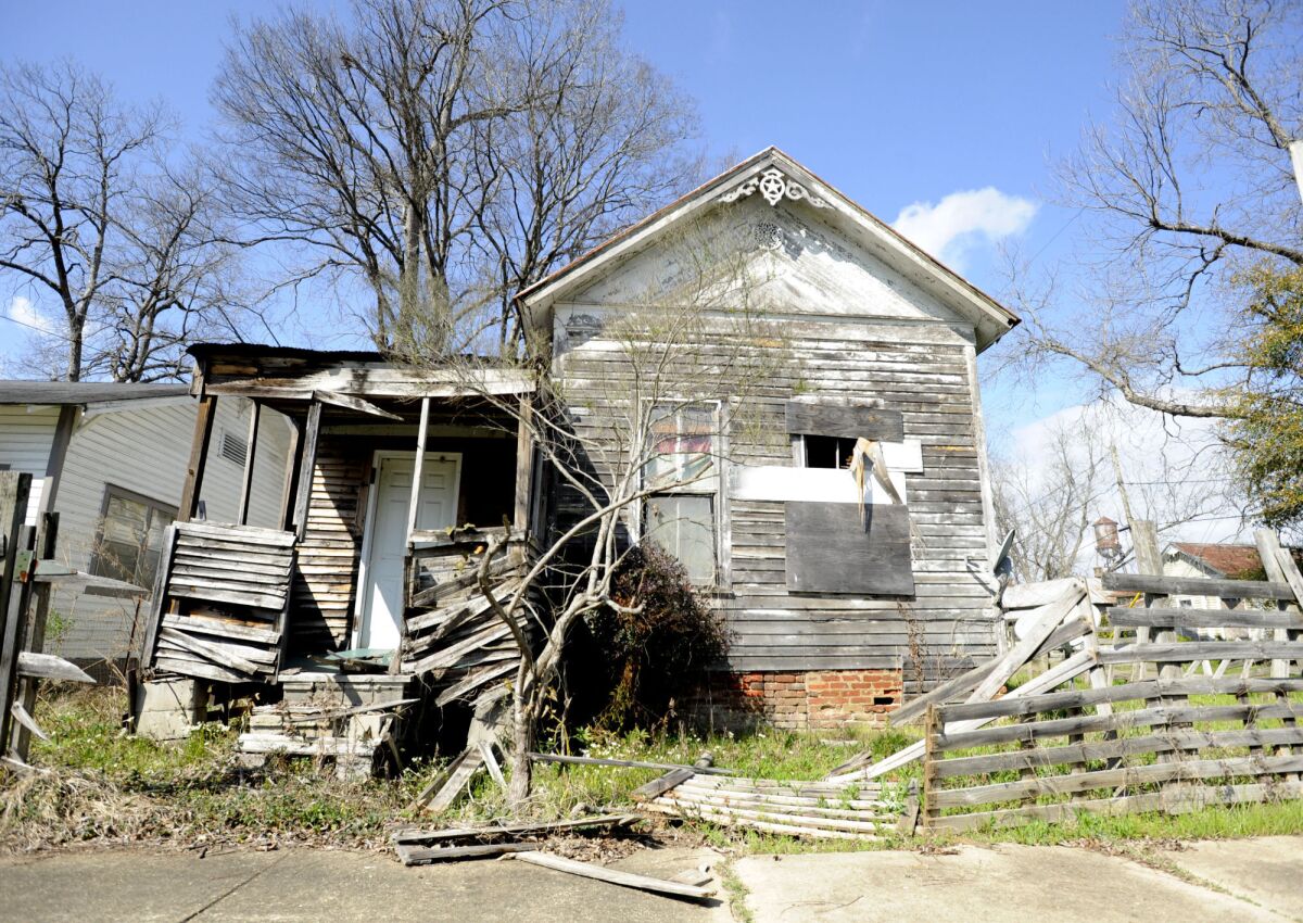 A partially collapsed home stands in Selma, Ala., on Thursday, Feb. 24, 2022. Despite being known worldwide as a beacon of voting rights, the city and surrounding Dallas County had one of the worst voter turnouts in Alabama for the 2020 presidential election, and some are trying to increase voter participation. (AP Photo/Jay Reeves)