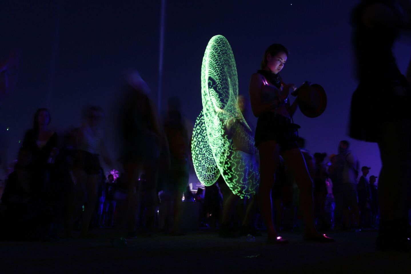 Justin Pohl, from Minneapolis, twirls a hula hoop on the final evening of the Coachella Valley Music and Arts Festival's first weekend.