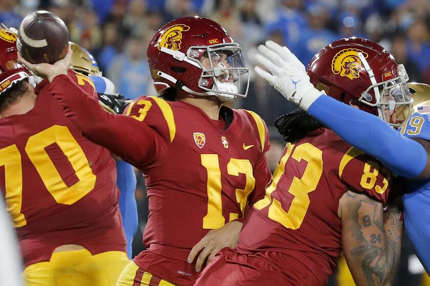 PASADENA, CALIF., NOV 19, 2022. USC quartwerback Caleb Williams throws under pressure from the. .