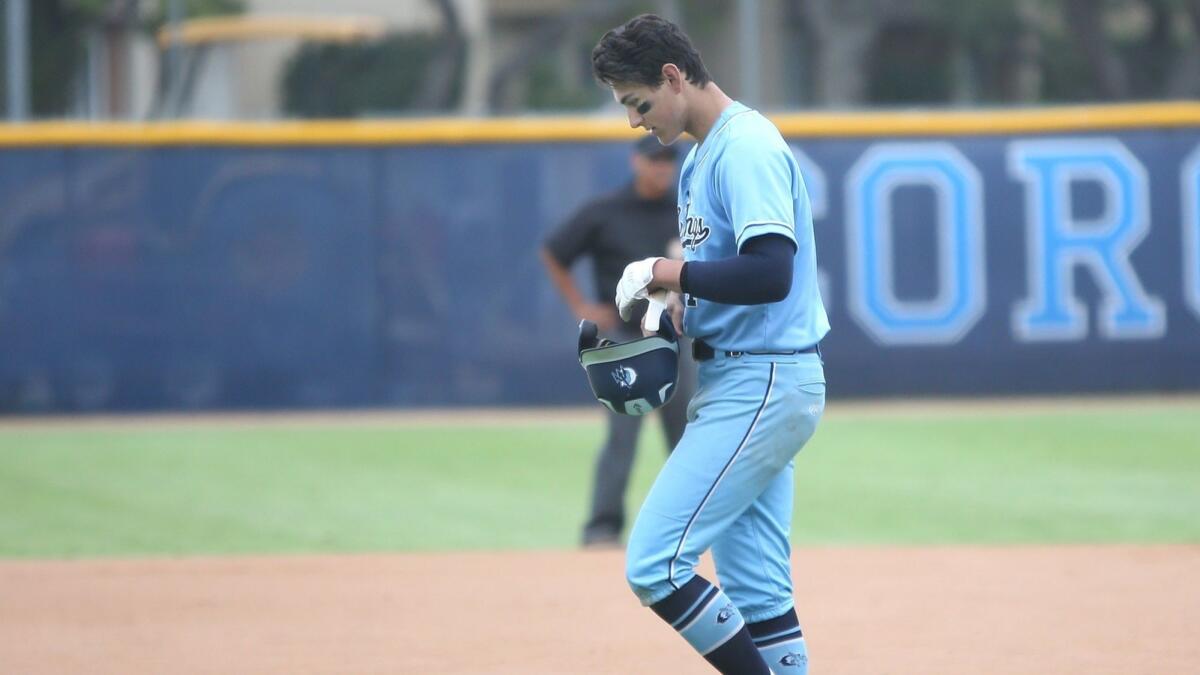 Corona del Mar High's Chazz Martinez walks off the field after being left on second base during the second round of the CIF Southern Section Division 2 playoffs against Yucaipa on Monday.