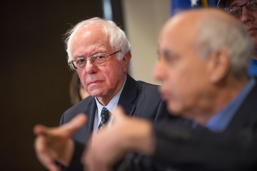 Democratic presidential candidate Bernie Sanders meets with union members in Michigan this month to discuss the effects of free-trade agreements on U.S. workers.