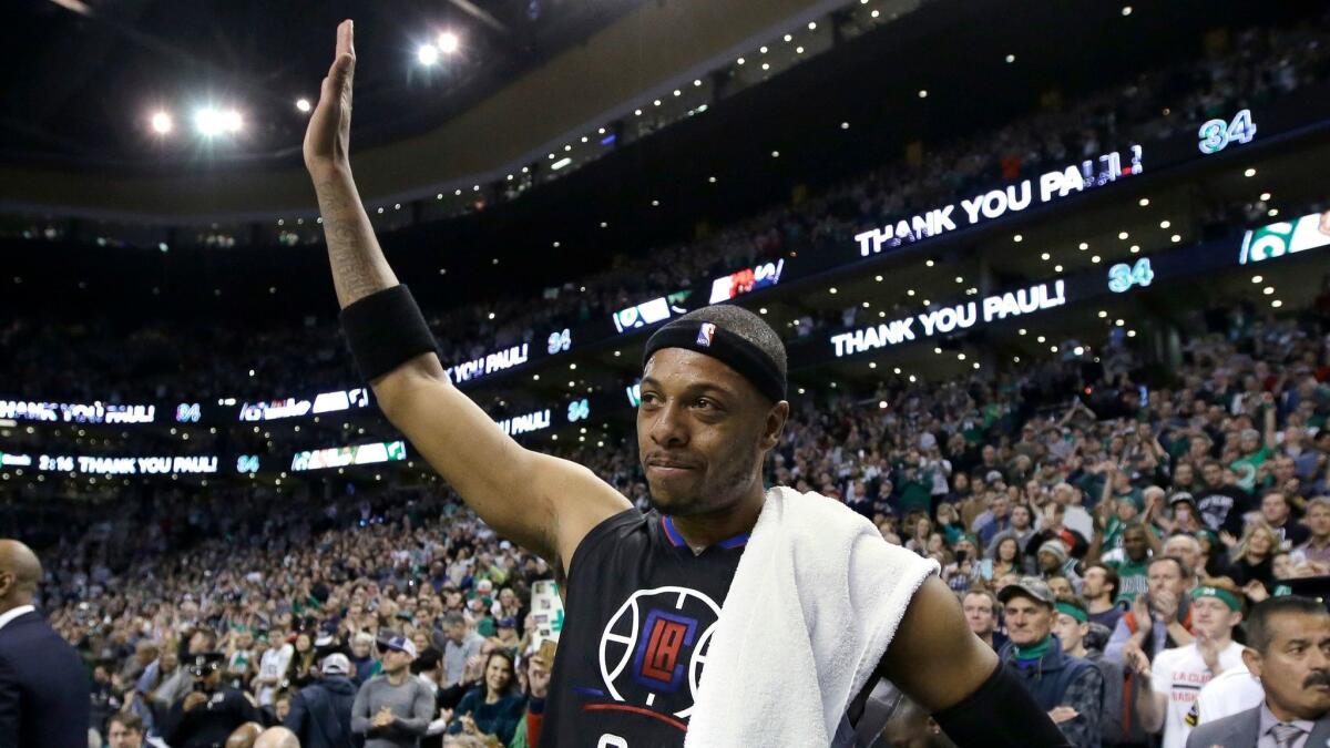 Clippers forward Paul Pierce acknowledges applause from the Boston crowd during a timeout on Feb. 5, the former Celtics star's last game ever in the city.