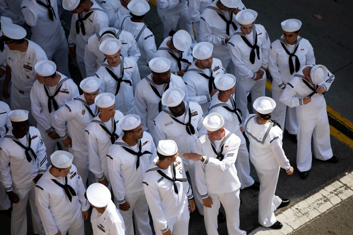 Navy sailors line up prior to a game between the San Diego Padres and the Cincinnati Reds 