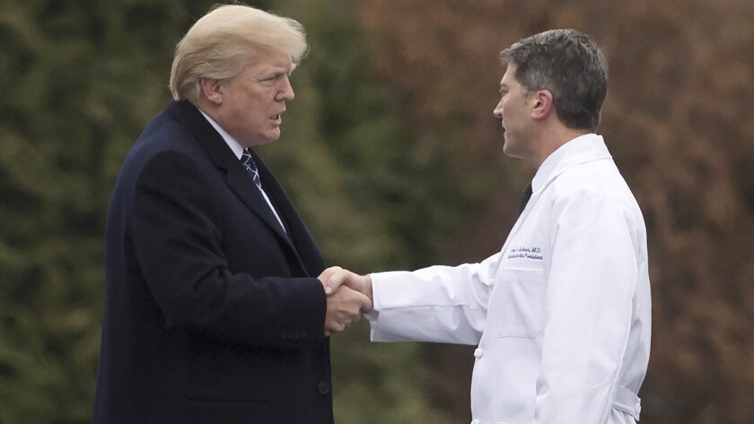President Trump on Jan. 12 with White House physician Dr. Ronny Jackson, who withdrew Thursday as Trump's nominee to be secretary of the Department of Veterans Affairs.