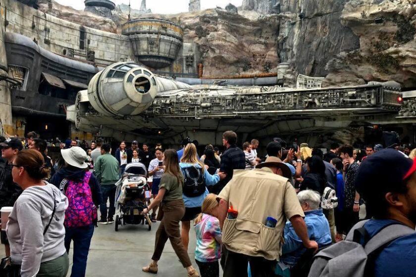 ANAHEIM, CALIF. - MAY 31, 2019 - Opening day crowds around the Millennium Falcon at Star Wars: Galaxy's Edge at Disneyland in Anaheim, Calif. on Friday, May 31, 2019. (Hugo Martin / Los Angeles Times)