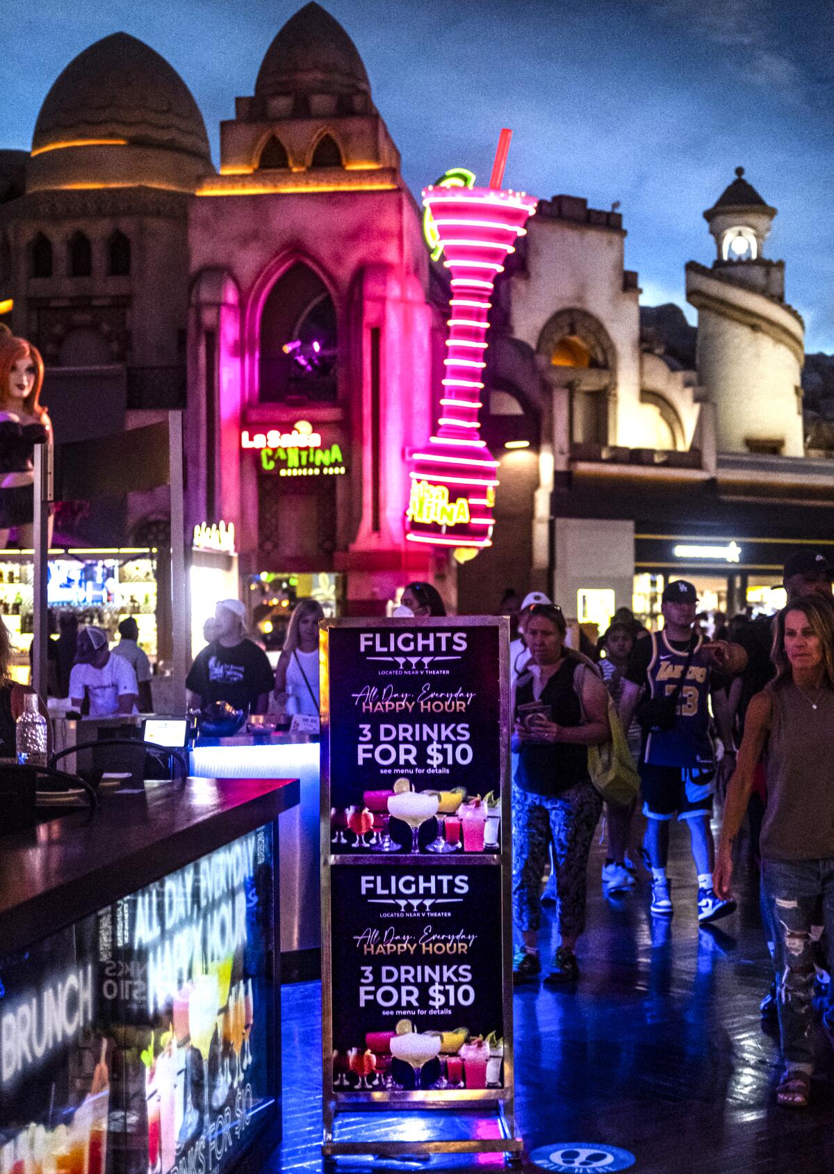 People stand outside of Flights at the Miracle Mile Shops at Planet Hollywood in Las Vegas.