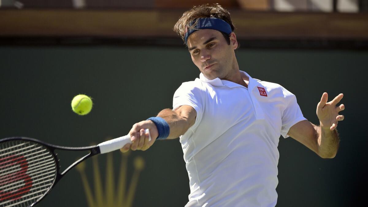 Roger Federer returns a shot during a 6-4, 6-4 victory over Hubert Hurkacz on Friday in a quarterfinal match of the BNP Paribas Open at Indian Wells.