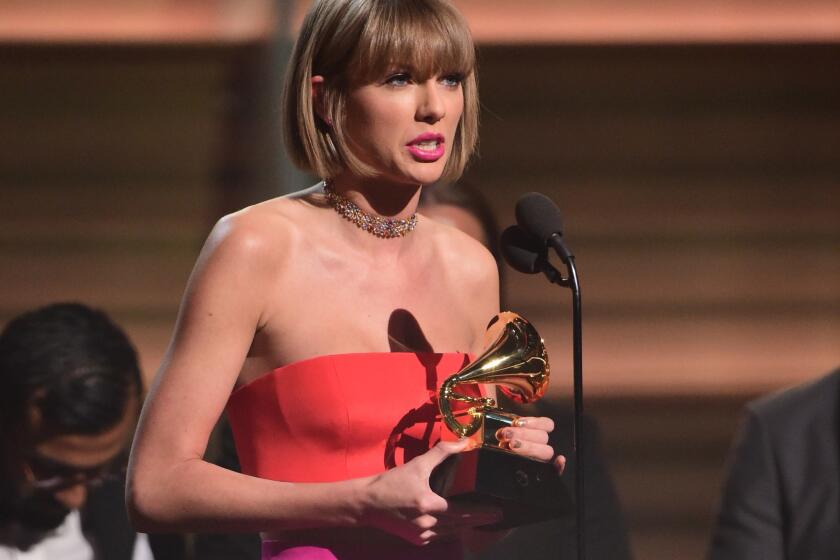 Singer Taylor Swift accepts the award for the Album of the Year onstage during the 58th Annual Grammy Awards in Los Angeles on Feb. 15, 2016.